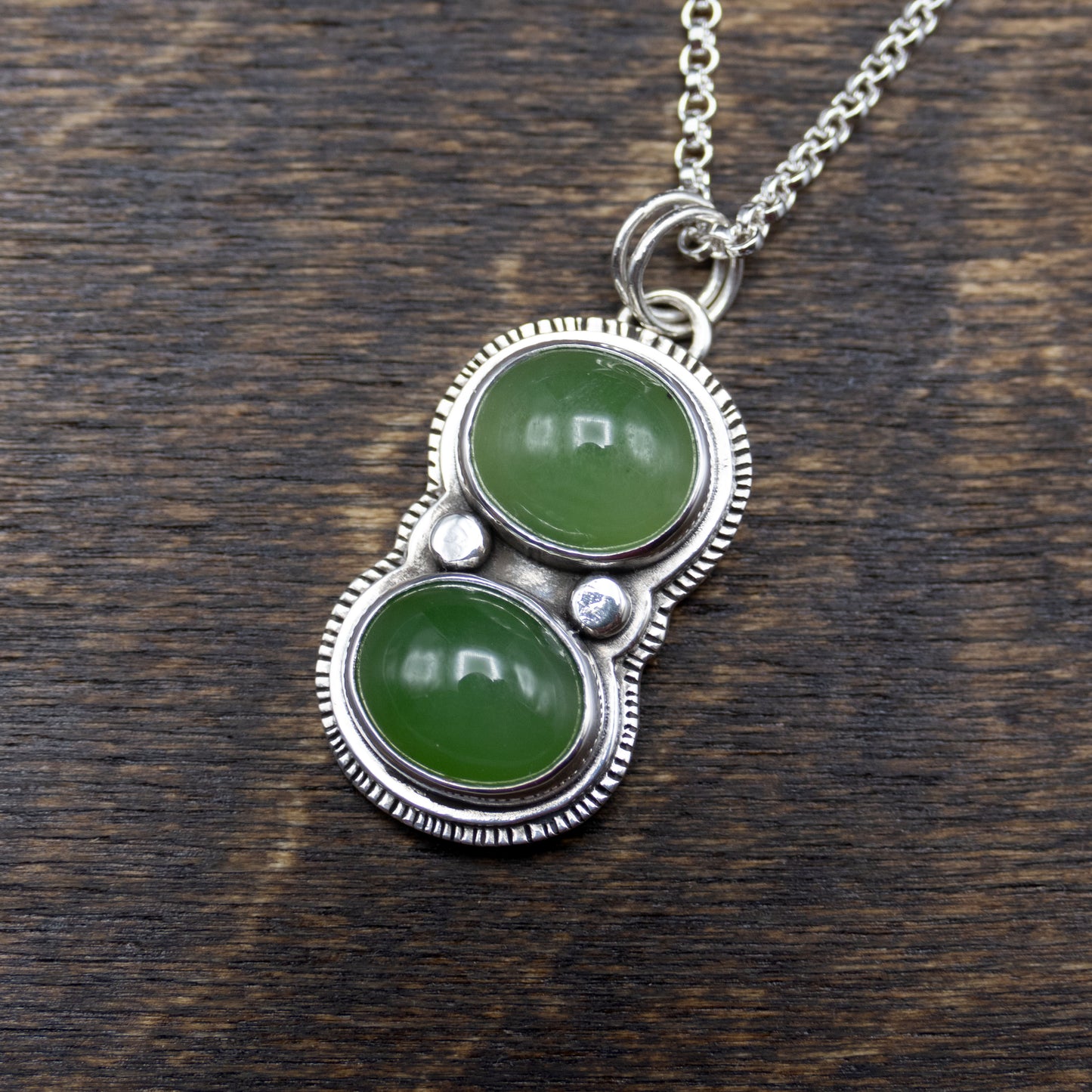 green jade and sterling silver pendant