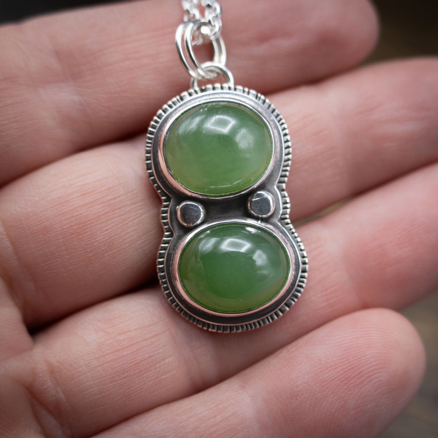 green jade and sterling silver pendant