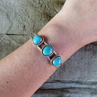 Fox turquoise and sterling silver cuff bracelet on arm