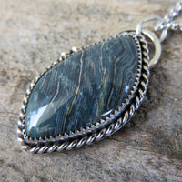 Blue petrified bog wood pendant