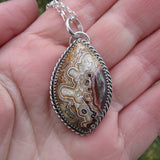 Mexican crazy lace agate and sterling silver pendant