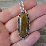 Yellow Mojave Jasper and Sterling Silver Pendant on hand